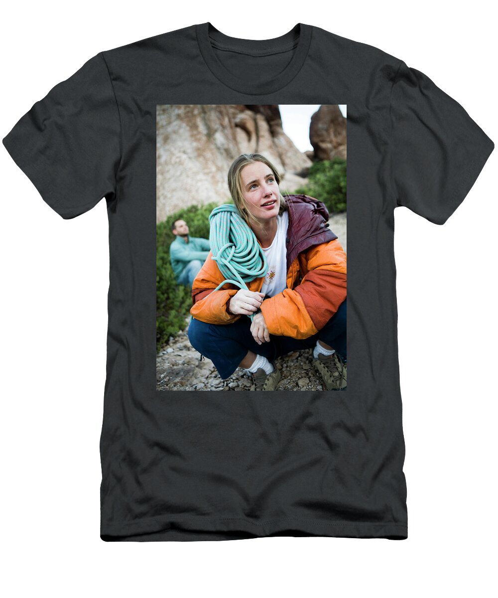 A Women Squats Down and Looks Jay Reilly T-Shirt