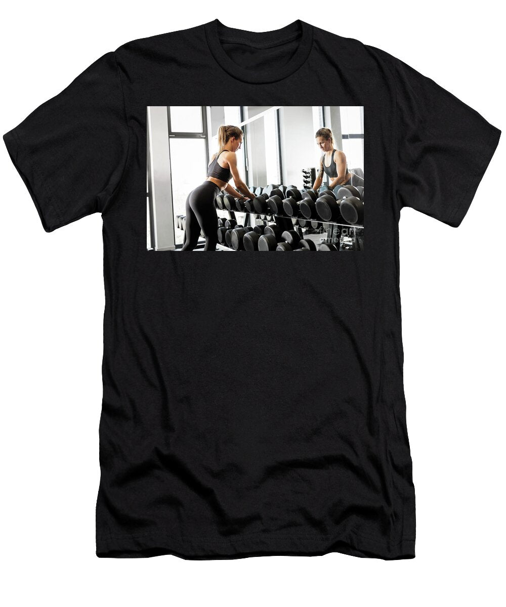 Attractive Woman Selecting Equipment At the Gym Michal Bednarek T-Shirt