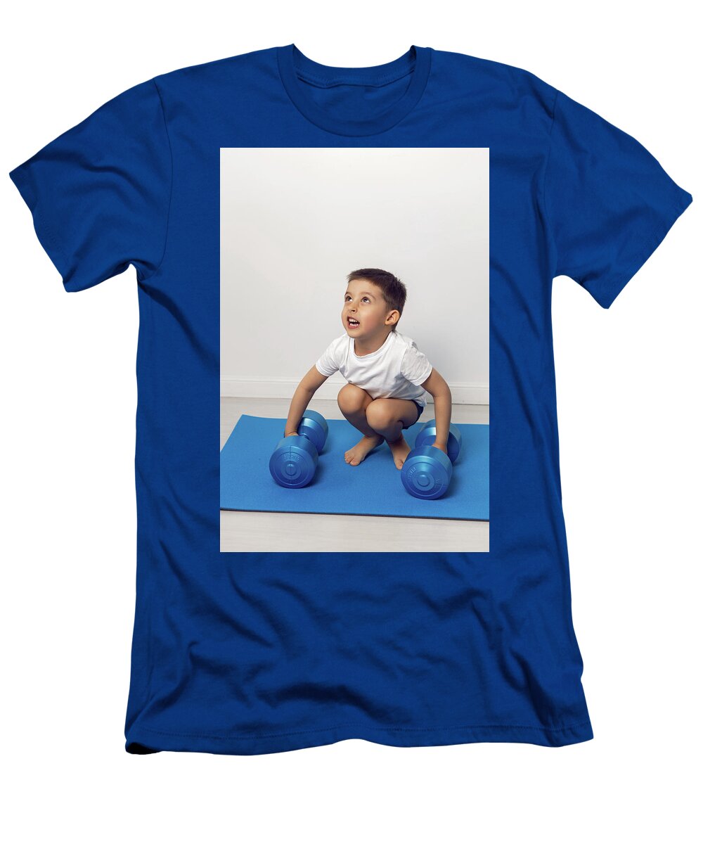 Boy Child of Four Years Old Lifts Dumbbells Five Kilograms in a White Room Standing Elena Saulich T-Shirt