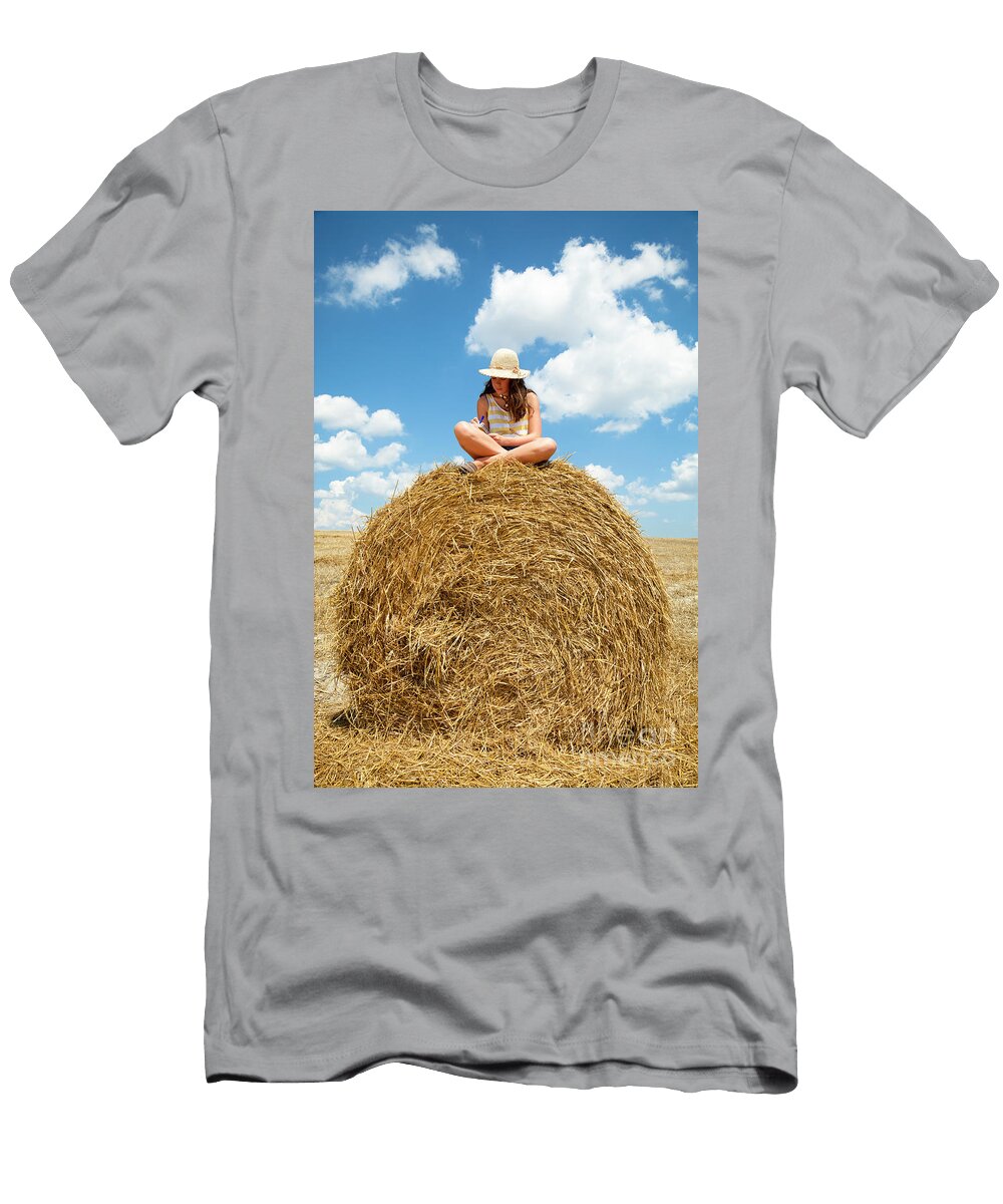 Chil Reading on a Hay Bale Carme Martinez T-Shirt