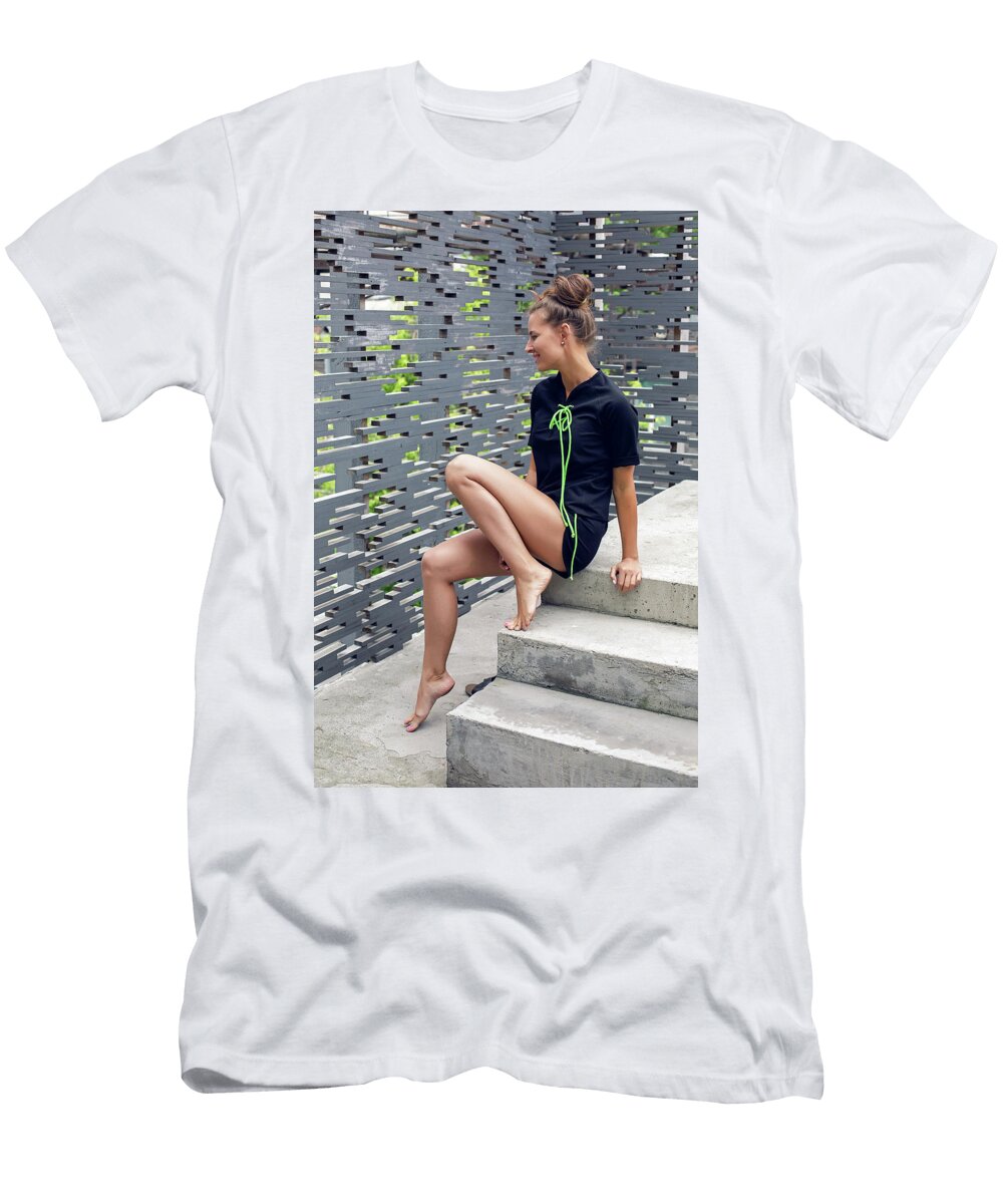 Girl in Sports Clothes Is Sitting on the Balcony Elena Saulich T-Shirt