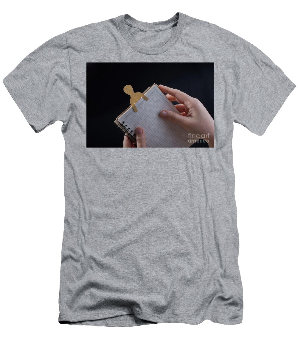Man Shape Cut Out of Paper in Notebbok Turgay Koca T-Shirt