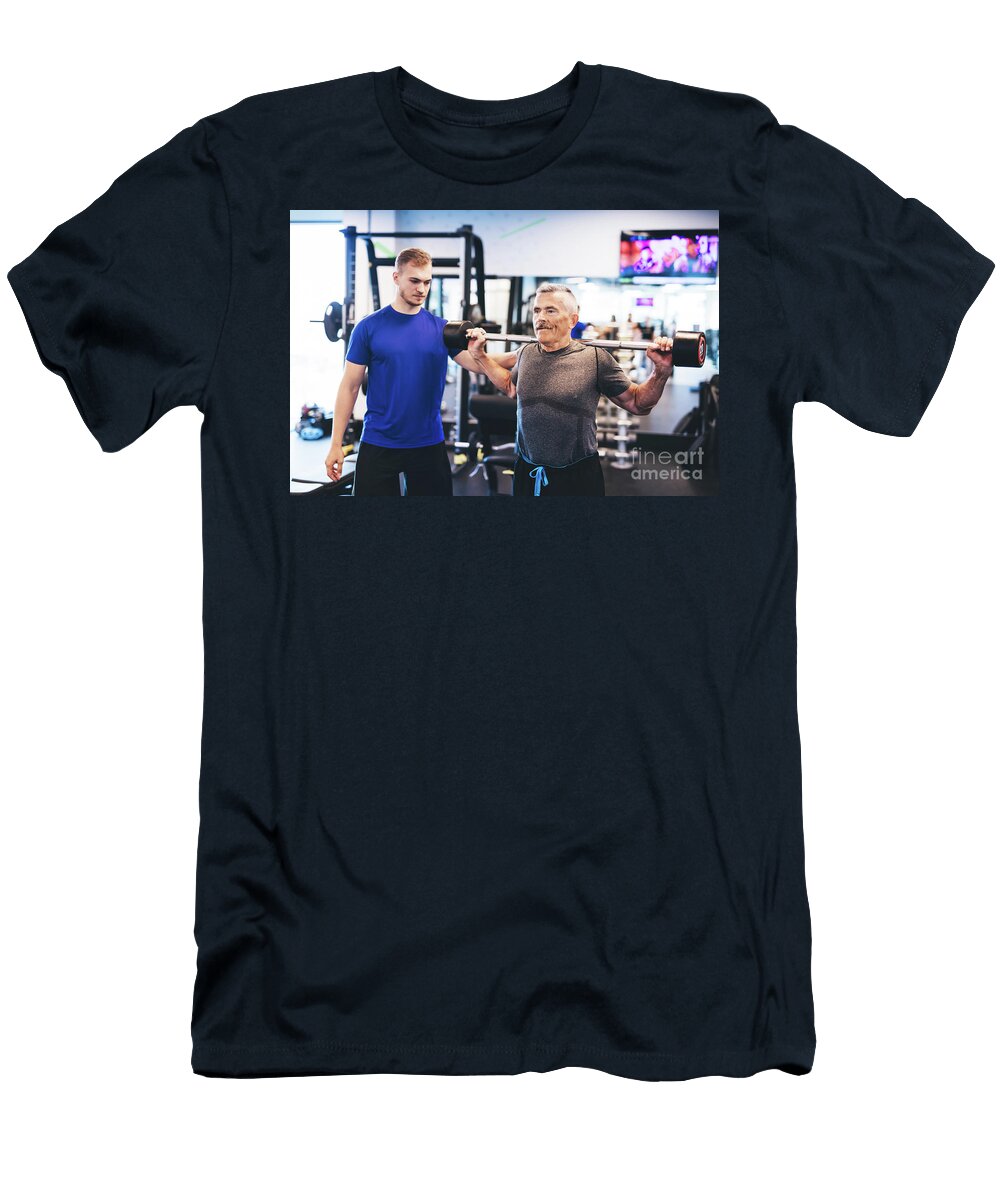 Older Man Assisting Senior Man At the Gym Michal Bednarek T-Shirt