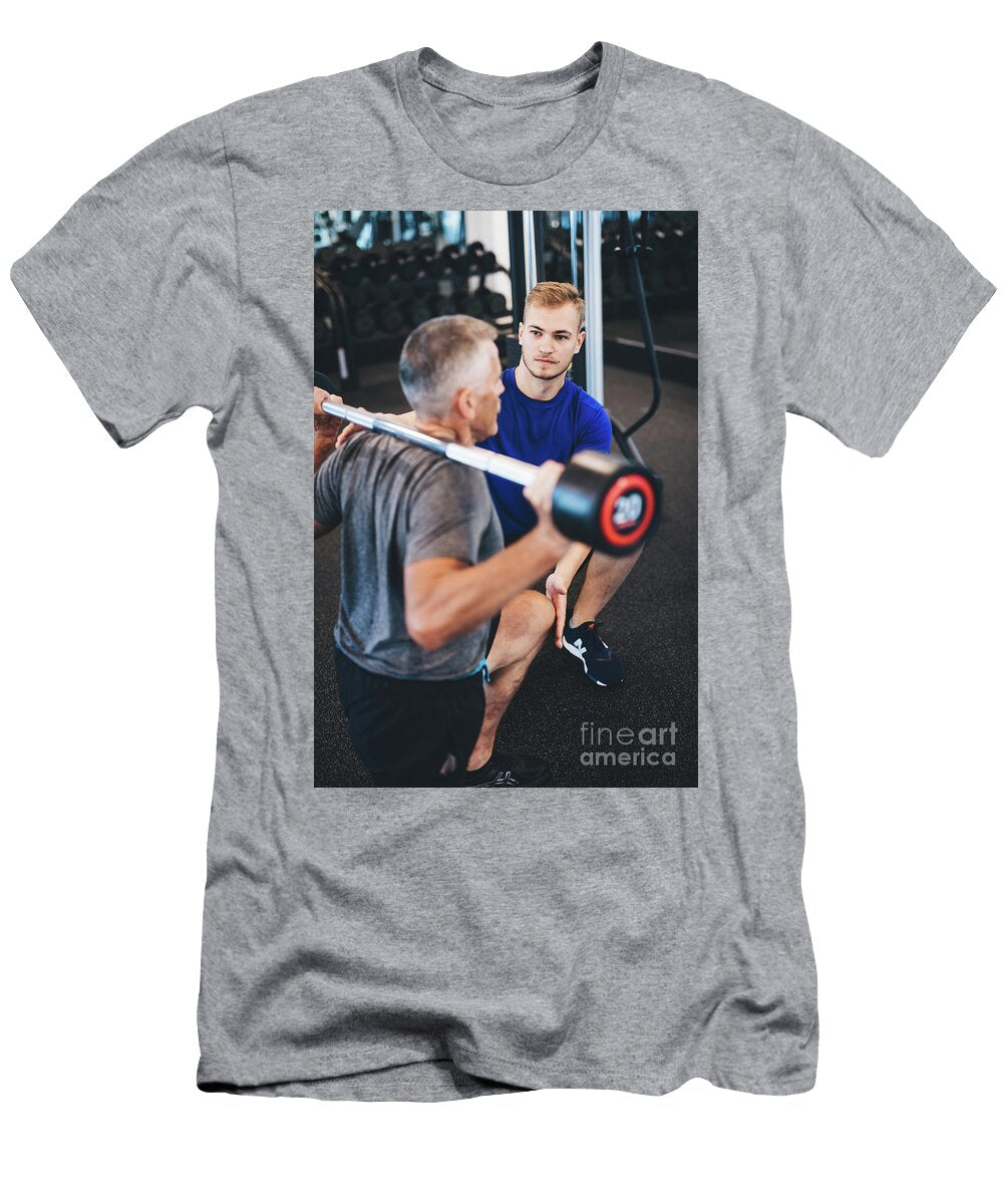 Personal Trainer and Senior Man Exercising At the Gym Michal Bednarek T-Shirt