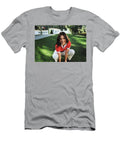 Smiling Woman Squats on Lawn House Visible Benjamin Shopli T-Shirt