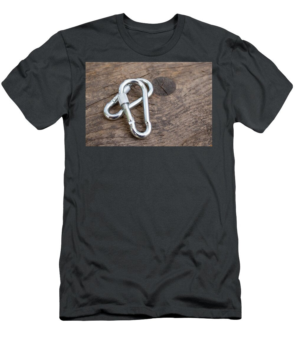 Two Silver Steel Carabines on Weathered Wood Background with Co Dorin Puha T-Shirt
