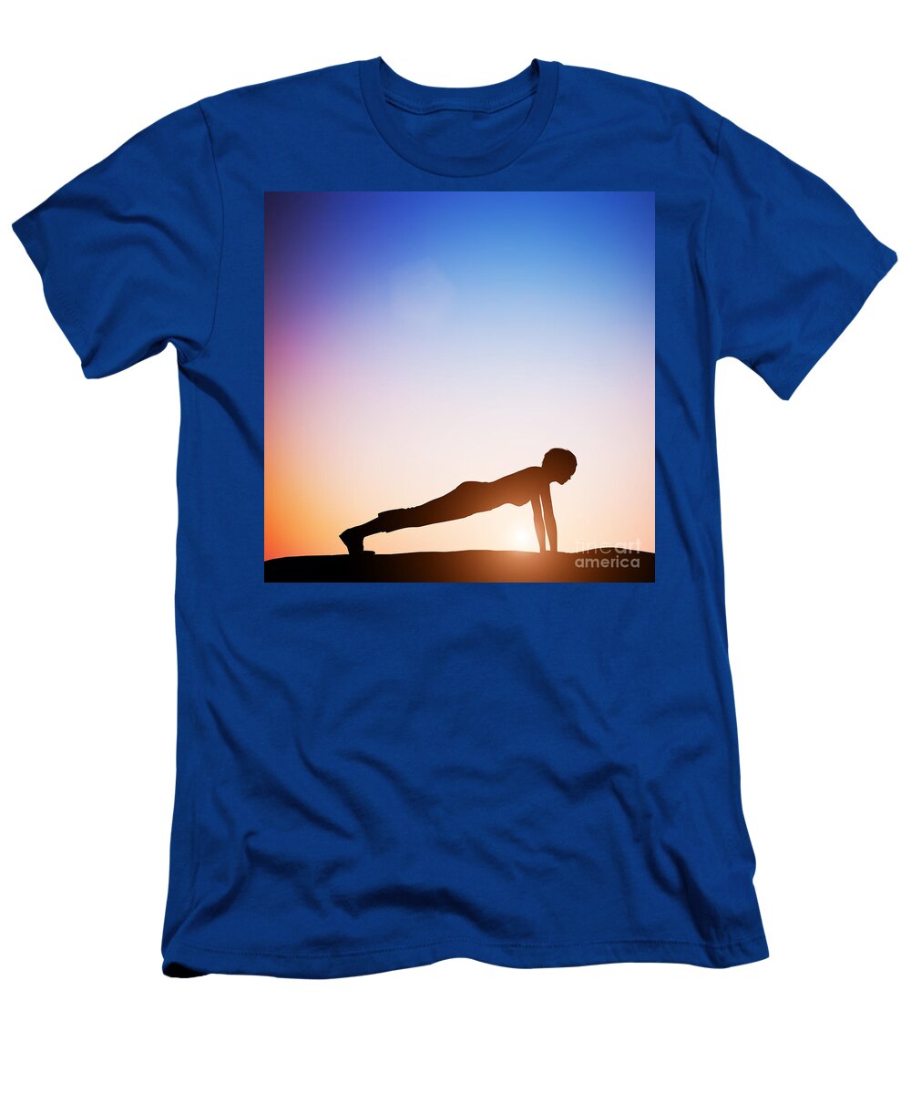 Woman in Plank Yoga Pose Meditating At Sunset Michal Bednarek T-Shirt