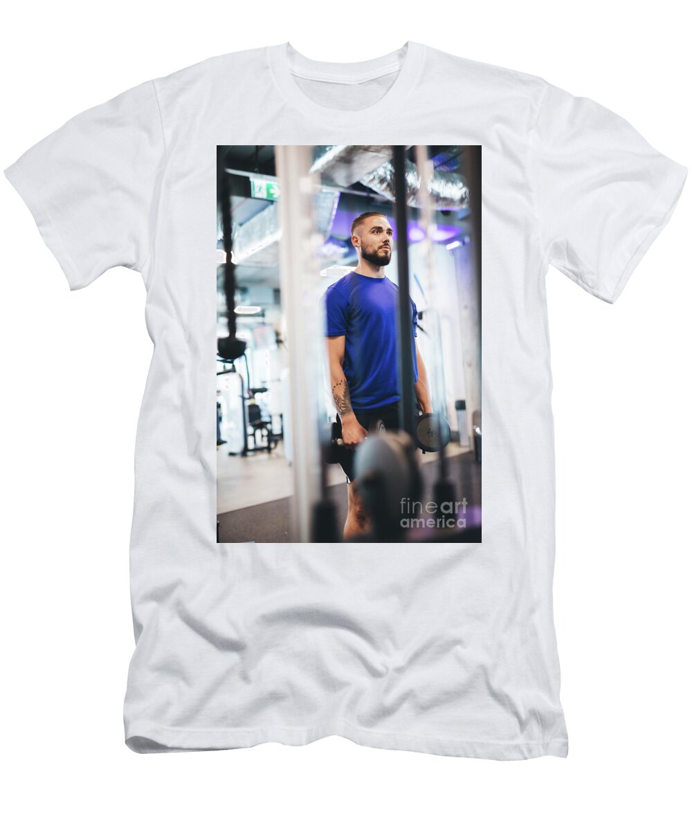 Young Man Standing with Dumbbells At the Gym Michal Bednarek T-Shirt
