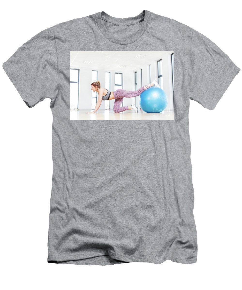 Young Woman Training with Fitball At Fitness Club Michal Bednarek T-Shirt
